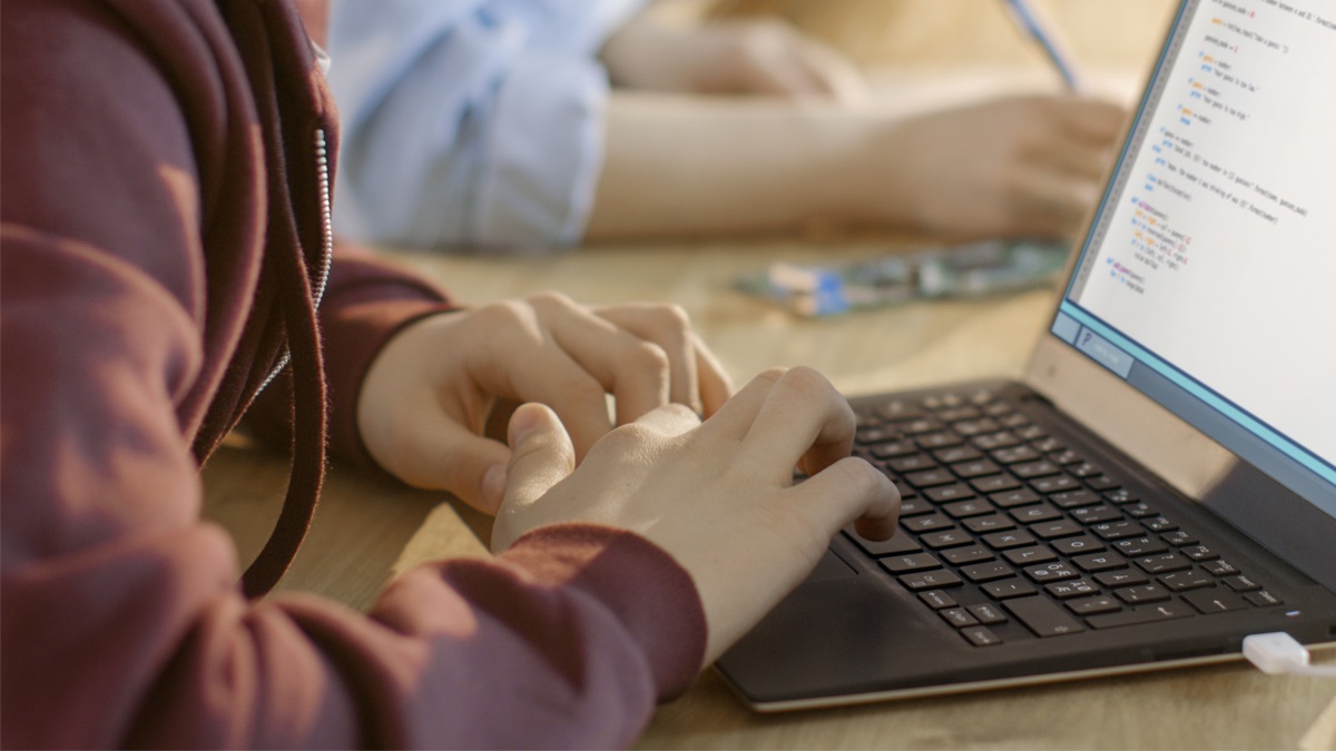 Hands on laptop keyboard