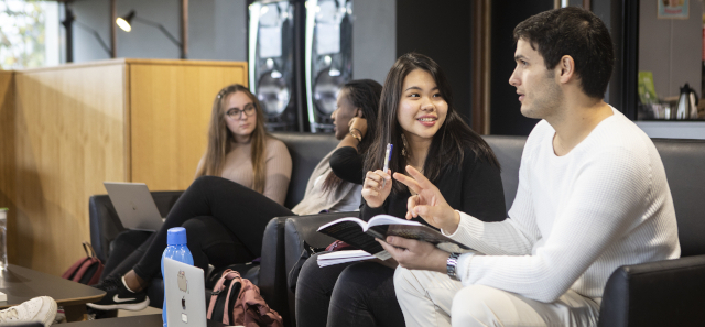 Students talking in the library