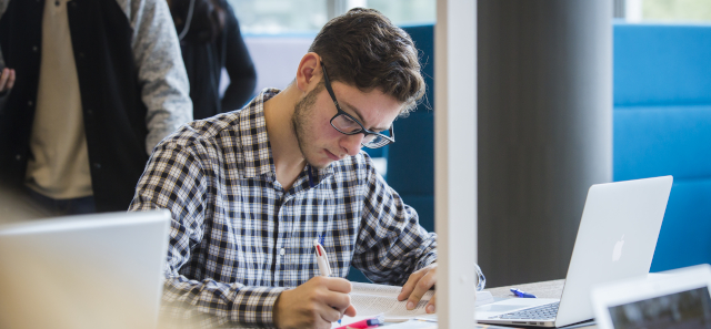 Student working with a laptop