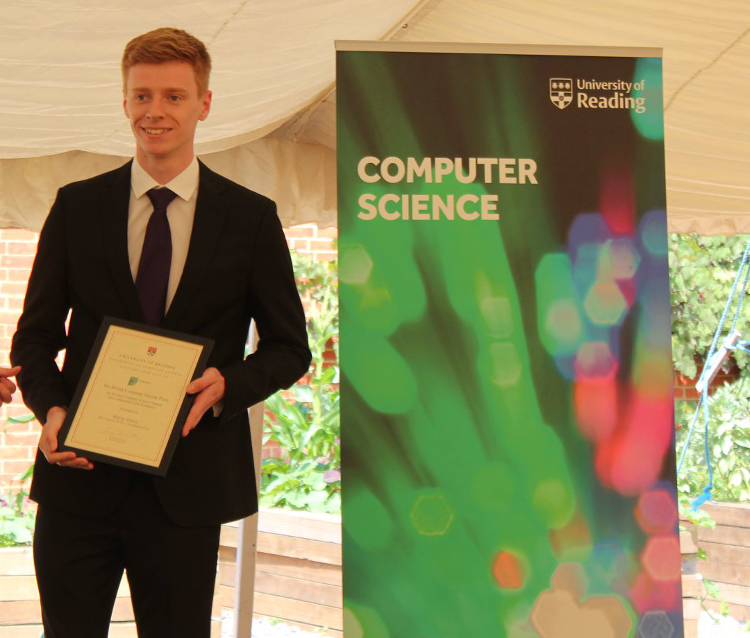 Marty Sweet holding his degree certificate